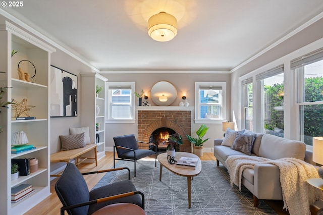 living area with plenty of natural light, wood finished floors, a brick fireplace, and crown molding