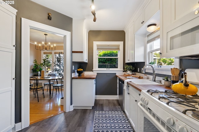kitchen with wooden counters, white appliances, a chandelier, and dark wood finished floors