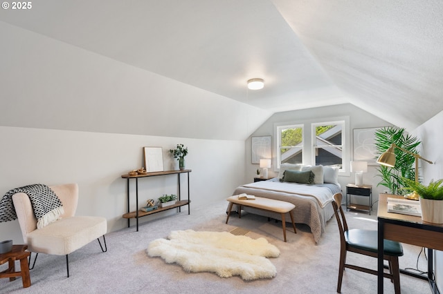 carpeted bedroom featuring vaulted ceiling