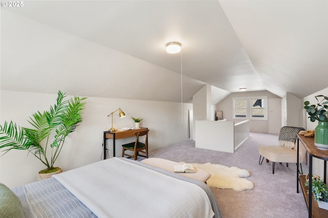 carpeted bedroom with vaulted ceiling