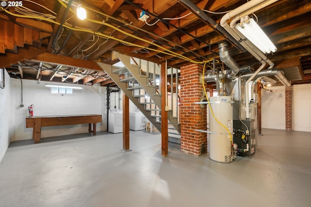 basement featuring water heater, washing machine and clothes dryer, stairway, and heating unit