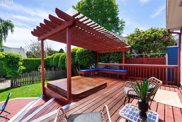 deck with a covered hot tub and a pergola