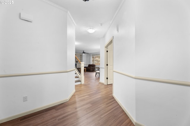 hall with crown molding and hardwood / wood-style floors