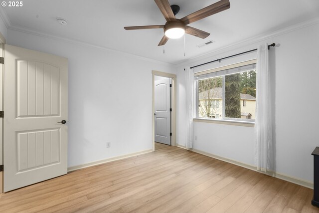 unfurnished bedroom featuring ceiling fan, light hardwood / wood-style floors, and ornamental molding