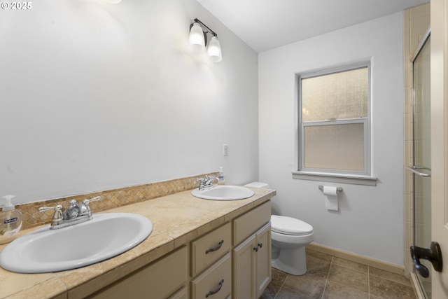 bathroom featuring vanity, toilet, and walk in shower