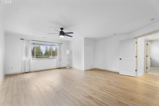 empty room with ceiling fan, light wood-type flooring, and ornamental molding