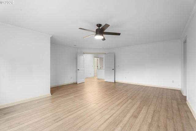 spare room featuring light hardwood / wood-style floors, ceiling fan, and crown molding