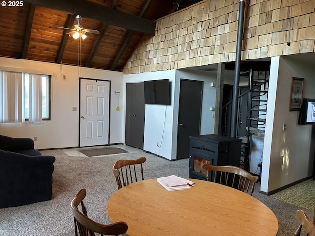 dining area with vaulted ceiling with beams, ceiling fan, carpet flooring, and wooden ceiling