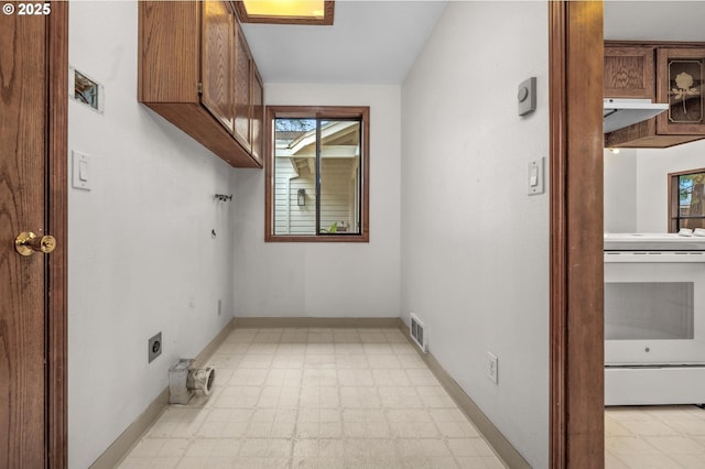 washroom featuring cabinets and electric dryer hookup