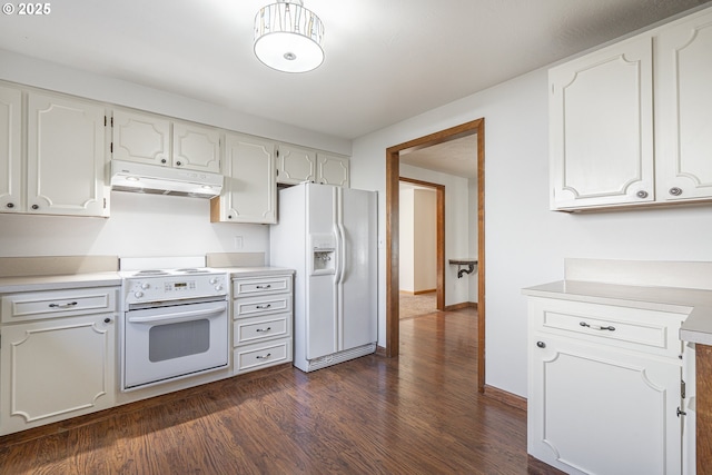 kitchen with white cabinetry, white appliances, and dark hardwood / wood-style floors