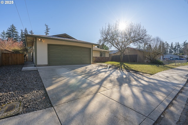 ranch-style home featuring a garage and a front lawn