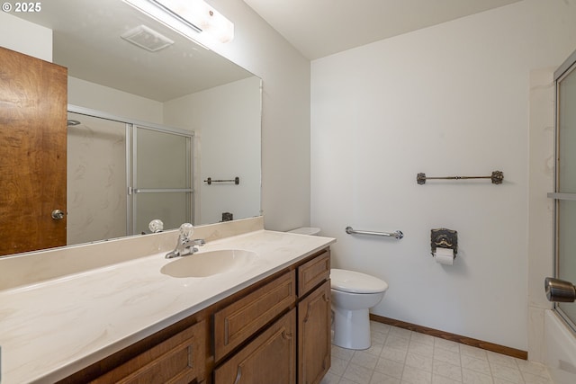 full bathroom featuring vanity, combined bath / shower with glass door, and toilet