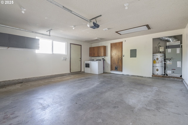 garage featuring heating unit, secured water heater, electric panel, a garage door opener, and washing machine and dryer