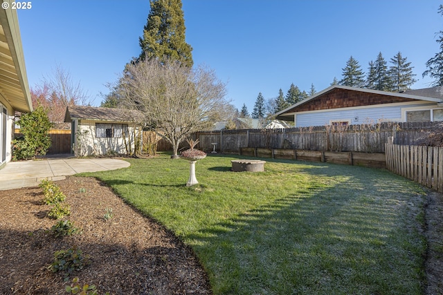 view of yard with an outdoor structure and a patio area