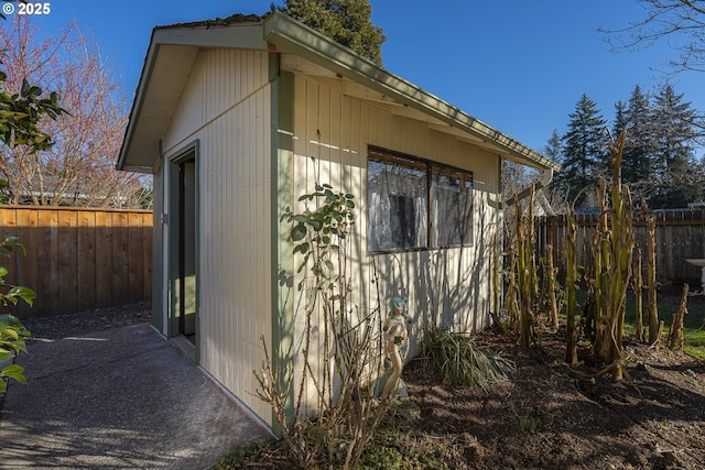 view of side of home with an outbuilding