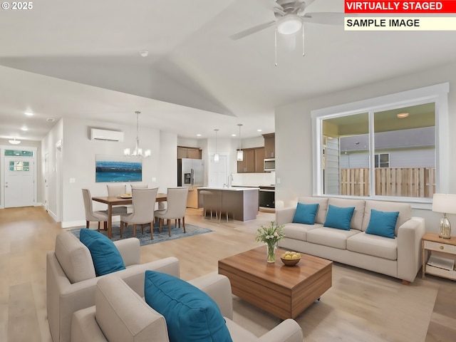 living area featuring light wood finished floors, recessed lighting, a wall unit AC, ceiling fan with notable chandelier, and lofted ceiling