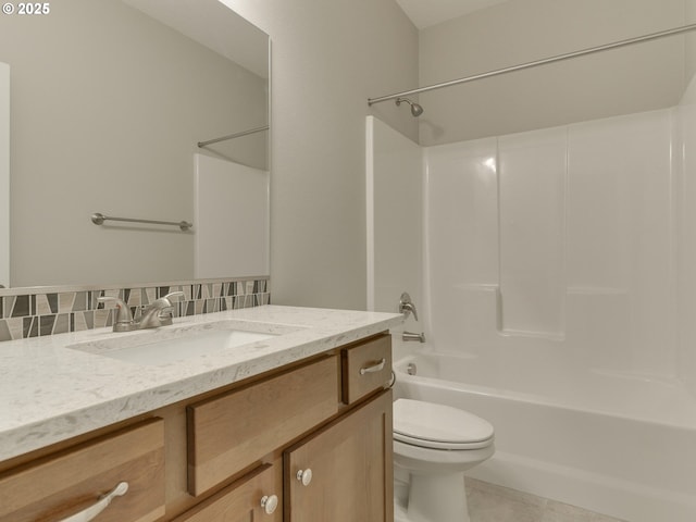 full bathroom featuring decorative backsplash, tile patterned floors, vanity, washtub / shower combination, and toilet