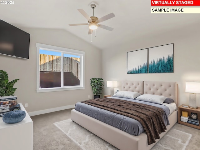 bedroom with carpet flooring, baseboards, and lofted ceiling