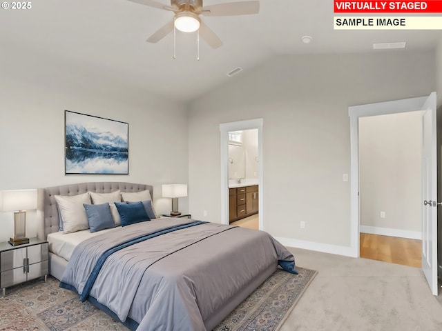 bedroom featuring visible vents, baseboards, connected bathroom, vaulted ceiling, and light colored carpet