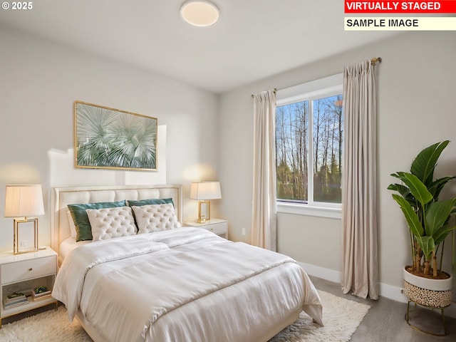 bedroom featuring baseboards and carpet floors