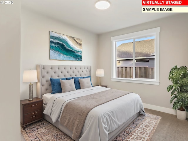 carpeted bedroom featuring baseboards