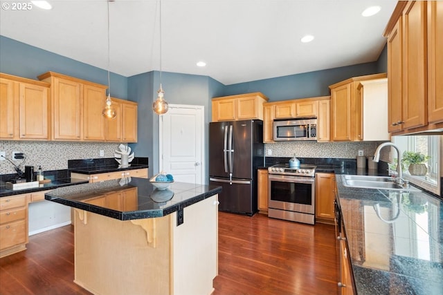 kitchen featuring dark wood-style flooring, tile countertops, stainless steel appliances, and a sink