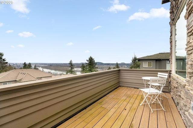 wooden deck featuring a water view