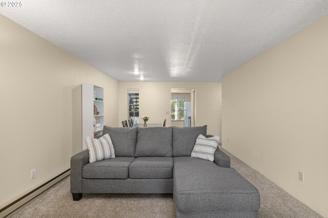 6160 SW Alice Ln Unit 203B, Beaverton, OR 97008 - dining space featuring a baseboard heating unit, a textured ceiling, and recessed lighting