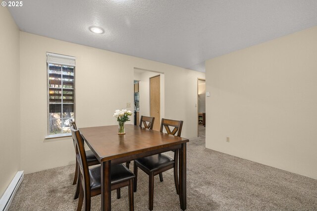 6160 SW Alice Ln Unit 203B, Beaverton, OR 97008 - dining space featuring carpet, a baseboard heating unit, and recessed lighting