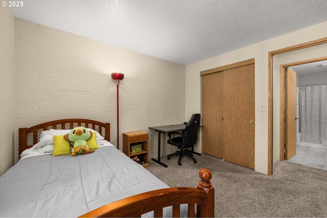 6160 SW Alice Ln Unit 203B, Beaverton, OR 97008 - laundry room featuring stacked washer / dryer, carpet floors, and a textured wall