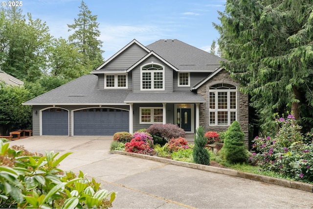 10540 SW Lancaster Rd, Portland, OR 97219 - traditional home with driveway, an attached garage, stone siding, and a shingled roof