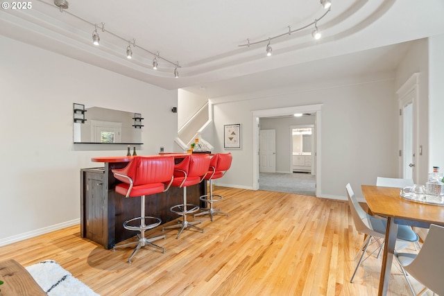10540 SW Lancaster Rd, Portland, OR 97219 - indoor dry bar featuring rail lighting, light wood-style flooring, and baseboards