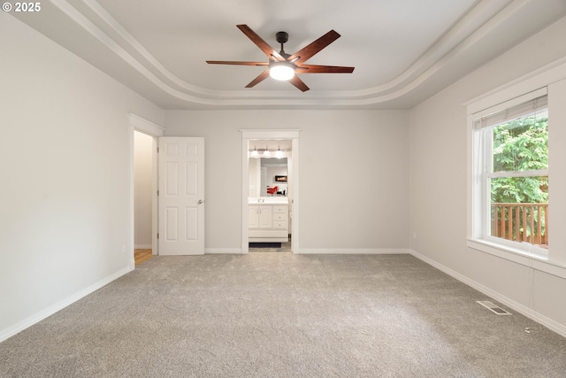 10540 SW Lancaster Rd, Portland, OR 97219 - unfurnished bedroom featuring a raised ceiling, carpet, baseboards, and ensuite bath