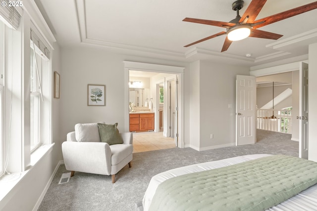 10540 SW Lancaster Rd, Portland, OR 97219 - bedroom featuring light colored carpet, a raised ceiling, baseboards, and connected bathroom