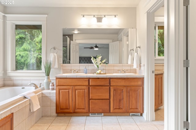 10540 SW Lancaster Rd, Portland, OR 97219 - full bath with plenty of natural light, a ceiling fan, tile patterned flooring, and a garden tub