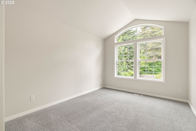 10540 SW Lancaster Rd, Portland, OR 97219 - carpeted empty room featuring vaulted ceiling and baseboards