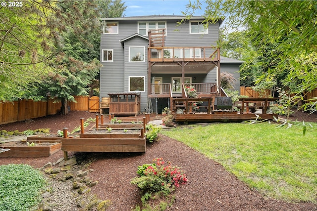 10540 SW Lancaster Rd, Portland, OR 97219 - back of property with a vegetable garden, a deck, and a balcony