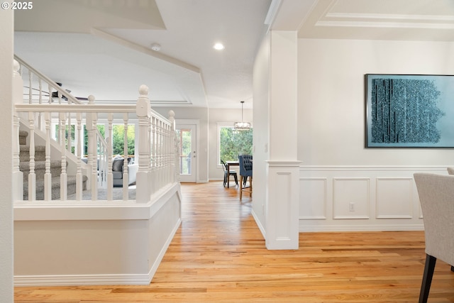 10540 SW Lancaster Rd, Portland, OR 97219 - corridor with light wood finished floors, stairs, recessed lighting, a decorative wall, and baseboards