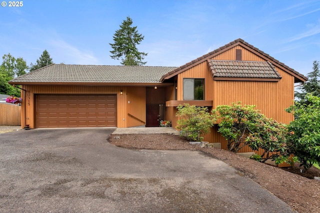 10315 SW 28th Ave, Portland, OR 97219 - view of front facade with a tile roof, a garage, and asphalt driveway