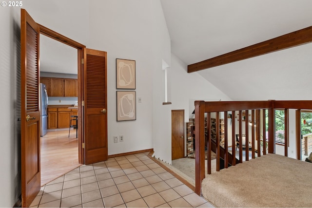 10315 SW 28th Ave, Portland, OR 97219 - hallway with an upstairs landing, high vaulted ceiling, beam ceiling, baseboards, and light tile patterned flooring