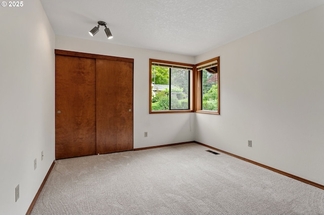 10315 SW 28th Ave, Portland, OR 97219 - unfurnished bedroom with carpet, a closet, and baseboards