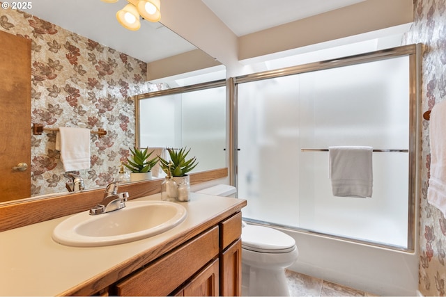 10315 SW 28th Ave, Portland, OR 97219 - full bath with vanity, toilet, bath / shower combo with glass door, wallpapered walls, and tile patterned floors