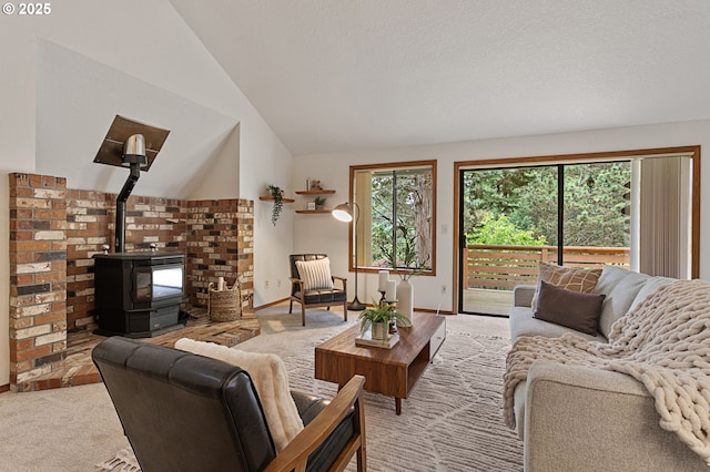 10315 SW 28th Ave, Portland, OR 97219 - living area with lofted ceiling, a wood stove, carpet, and baseboards