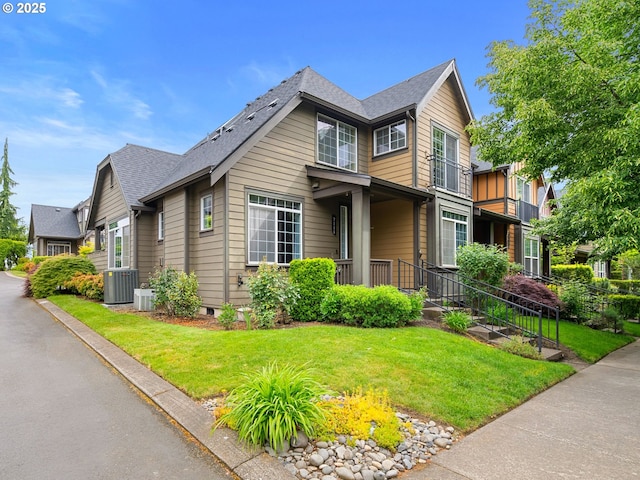 7111 NE Stonewater St, Hillsboro, OR 97124 - view of front of home with a front yard, central AC unit, and roof with shingles