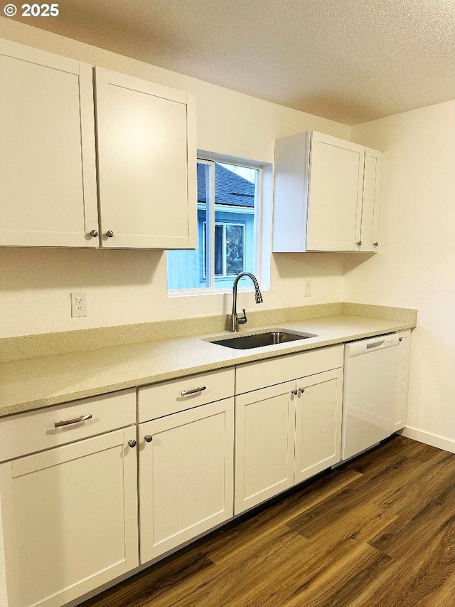 kitchen with dark wood-style floors, white dishwasher, a sink, a textured ceiling, and white cabinetry