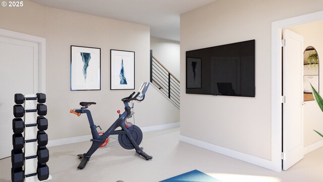 workout area with carpet and baseboards