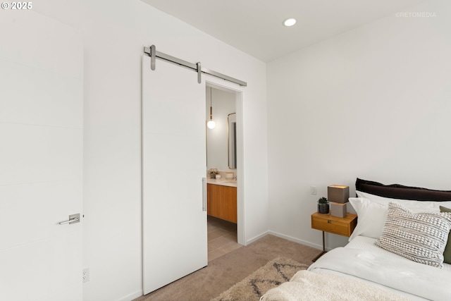2417 E 6th St, Vancouver, WA 98661 - bedroom with recessed lighting, a barn door, light colored carpet, and baseboards
