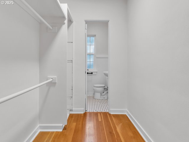 spacious closet with wood finished floors