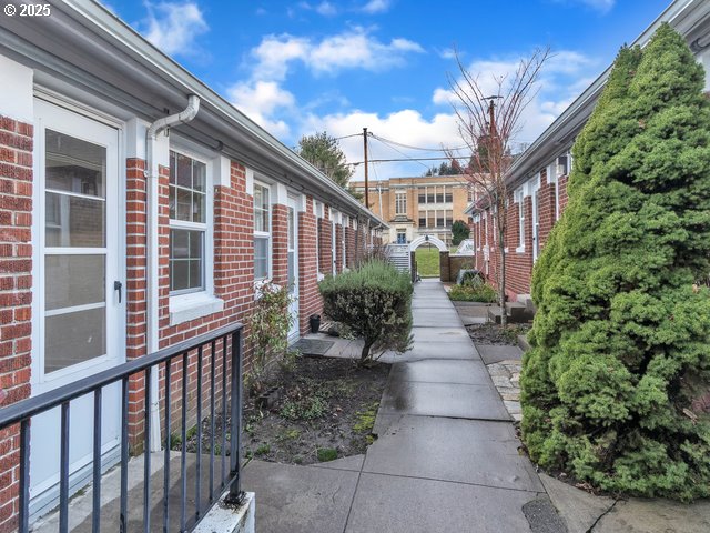 view of side of property with brick siding