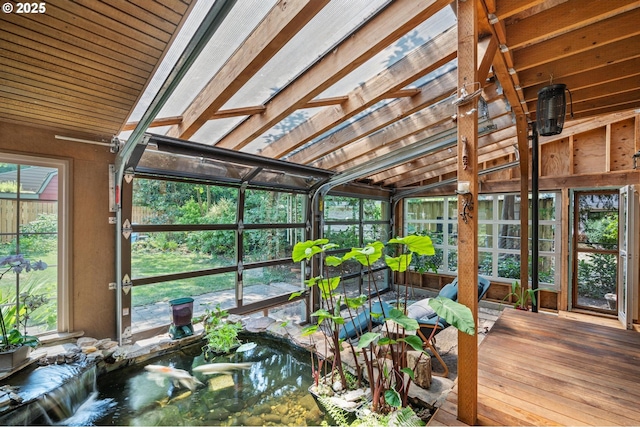 sunroom featuring a garden pond